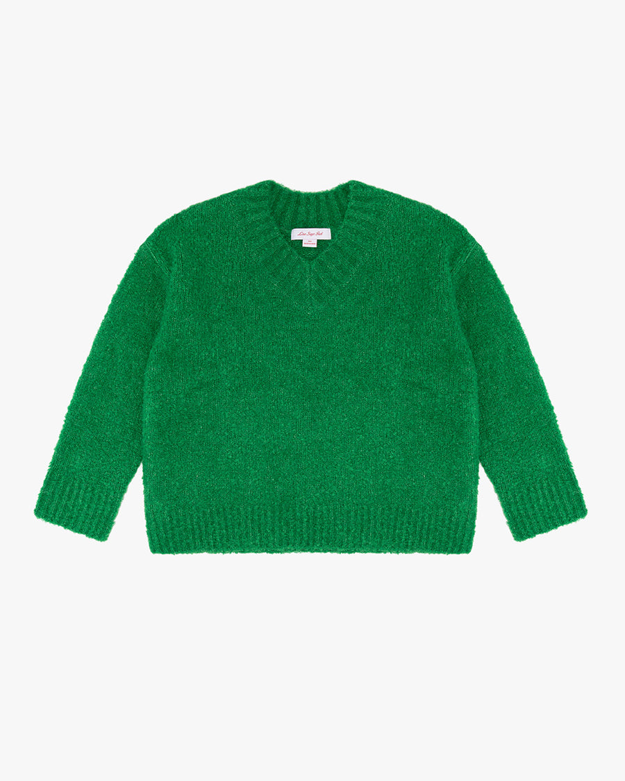 green textured v-neck sweater and twill skirt