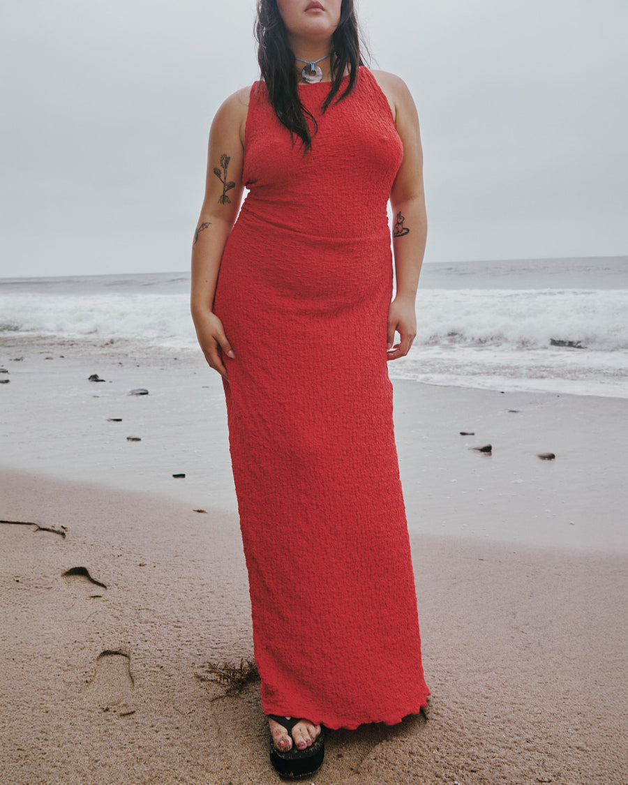 model wearing pepper red crinkle tank maxi dress with open tie back