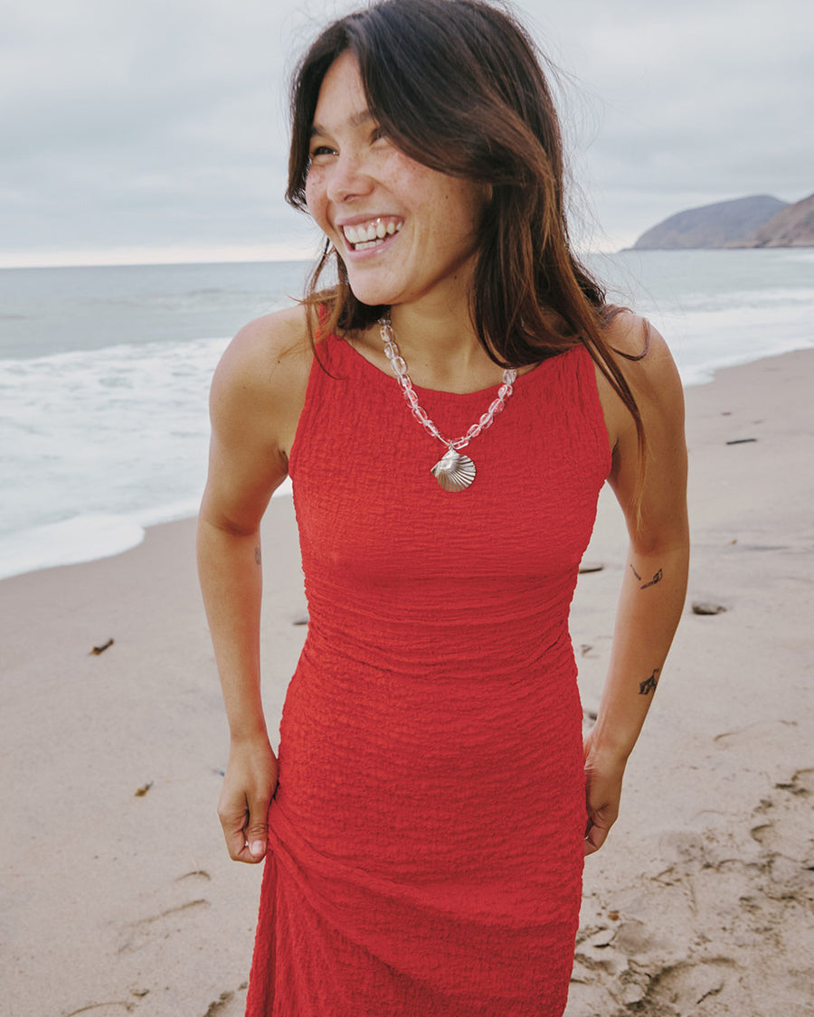 up close of model wearing pepper red crinkle tank maxi dress with open tie back