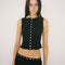 model wearing cropped black crinkle button front tank with various shaped shell buttons
