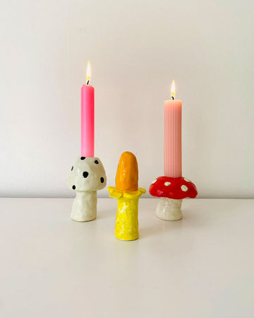 set of three mushroom taper candle holders: black and white dot, red and white dot and yellow mushrooms