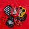set of 7 mickey and minnie makeup erasers with matching pouch on a red ground