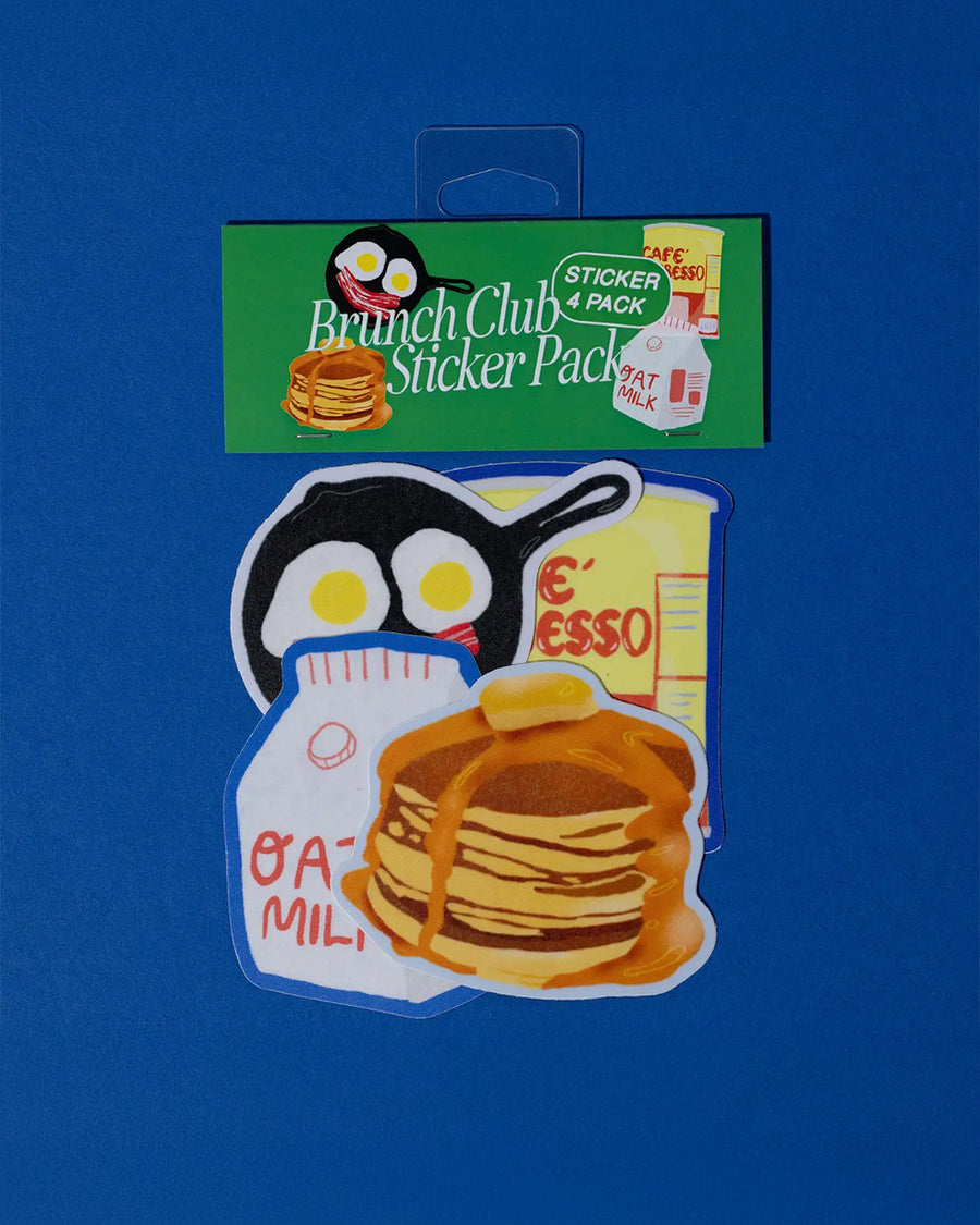packaged set of 4 brunch stickers: frying pan with egg and bacon smiley, cafe espresso can, stack of pancakes, and a carton of oat milk