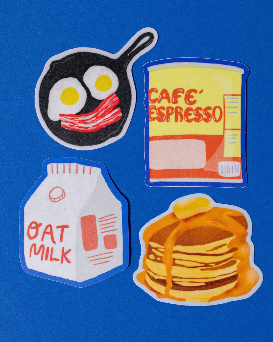 set of 4 brunch stickers: frying pan with egg and bacon smiley, cafe espresso can, stack of pancakes, and a carton of oat milk