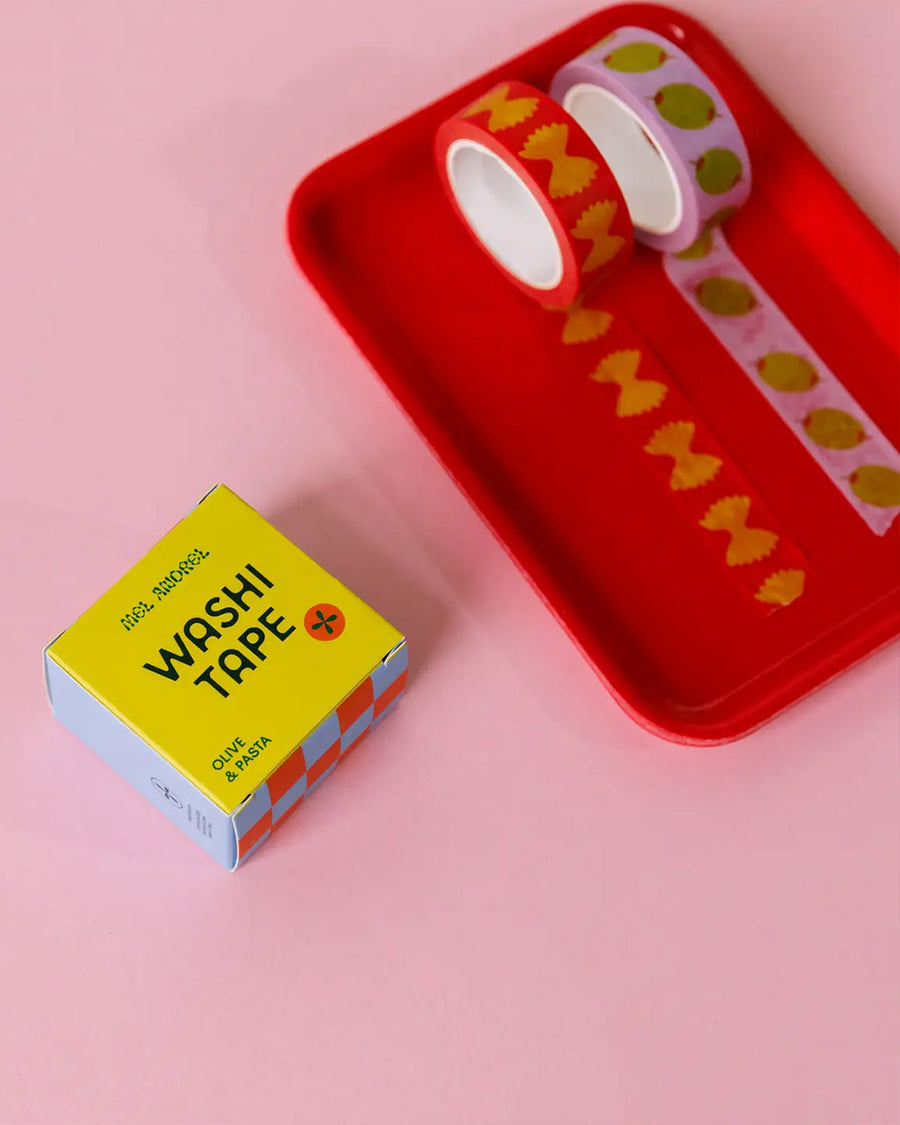 set of two rolls of washi tape: pink tape with olives, and red with bowtie pasta on a tray