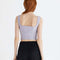 back view of model wearing lavender structured sleeveless crop top with piping detail