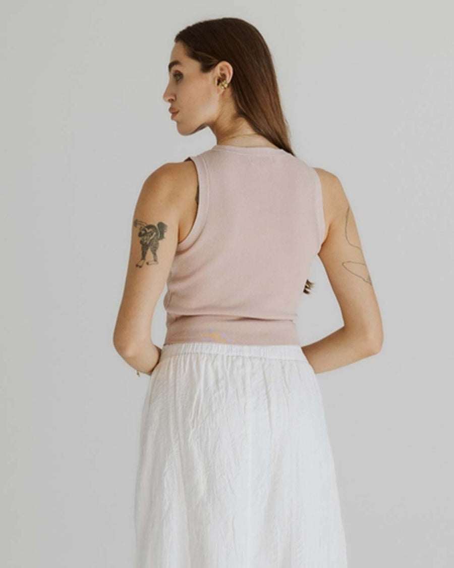 back view of model wearing blush cropped high neck tank