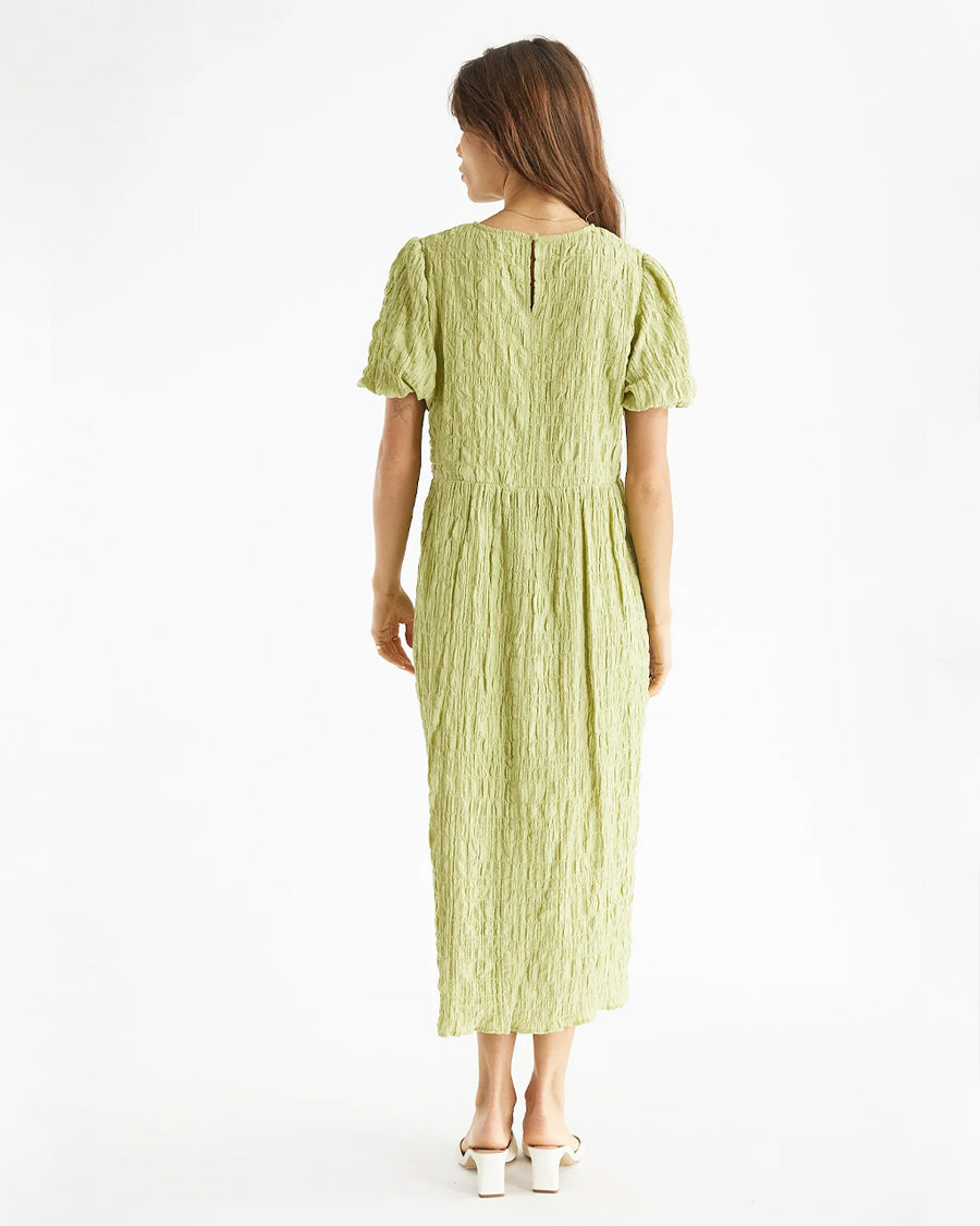 backview of model wearing lime green midi dress with crinkle material and short sleeves