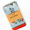 packaged blue tea towel with colorful folk floral print and red trim