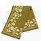 olive green tea towel with white floral silhouette pattern