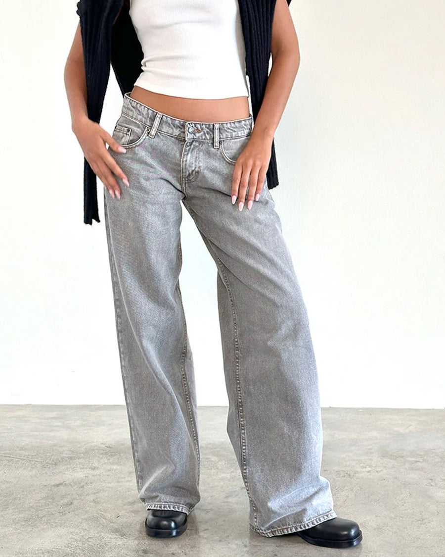 model wearing light grey low rise wide leg denim and white tank