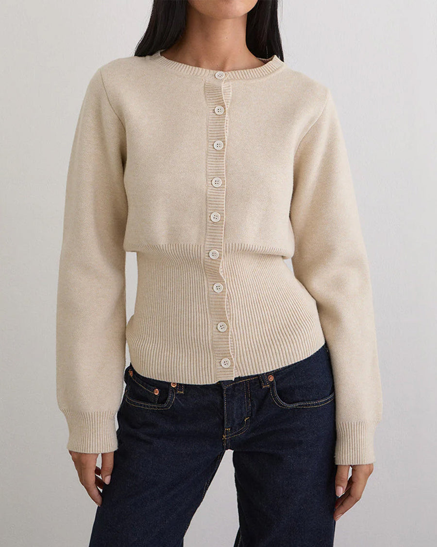 model wearing ivory cardigan with cinched in waist