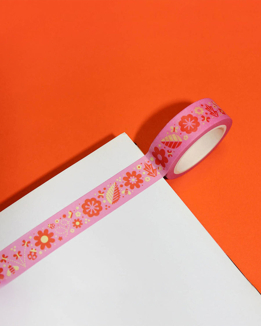 roll of pink washi tape with yellow and orange retro floral print