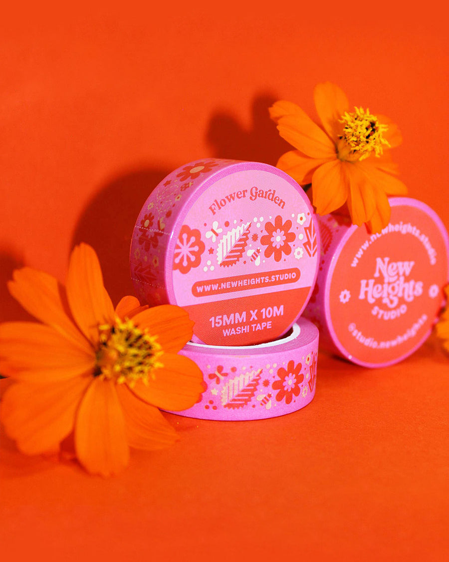 packaged roll of pink washi tape with yellow and orange retro floral print
