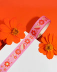 roll of pink washi tape with yellow and orange retro floral print