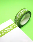 roll of green washi tape with vintage white pyrex floral print