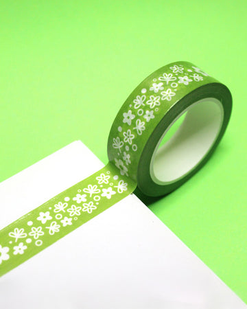 roll of green washi tape with vintage white pyrex floral print