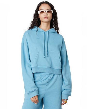 model wearing blue cropped boxy hoodie sweatshirt
