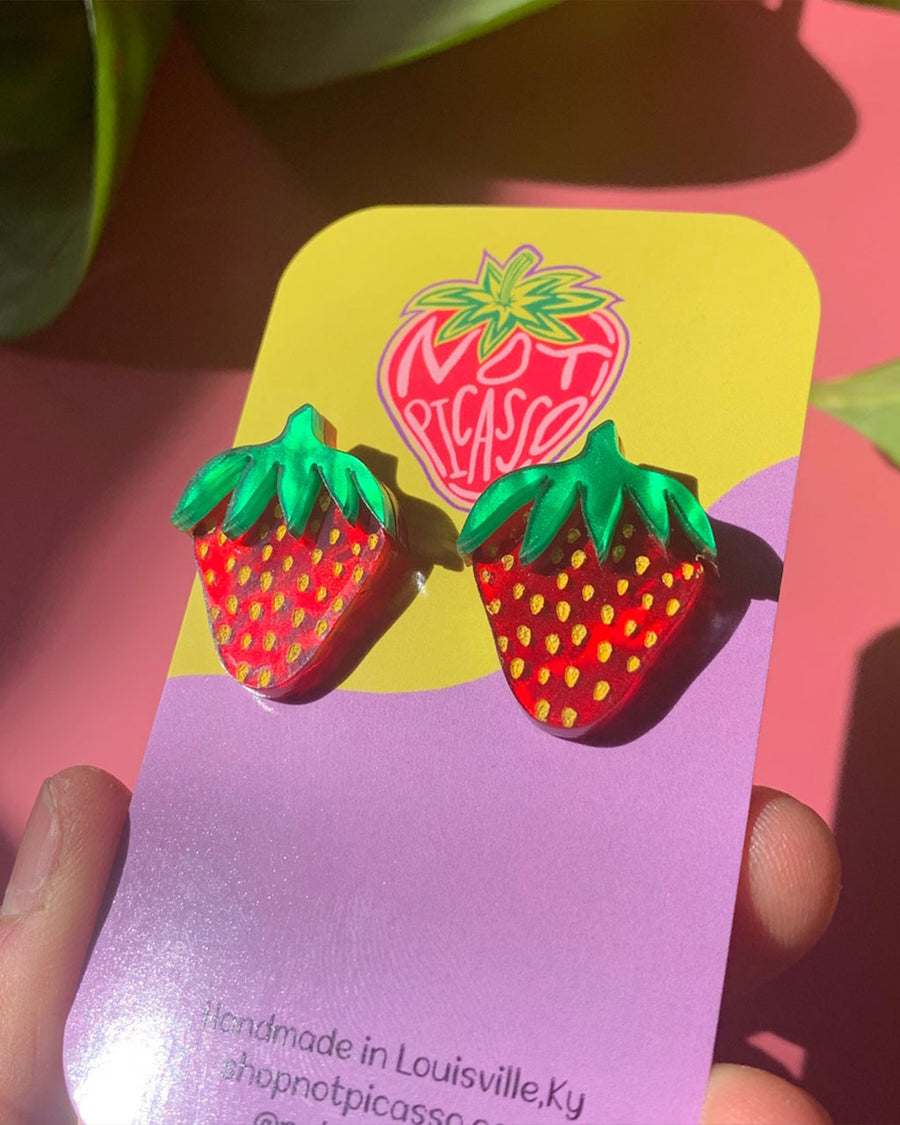 small strawberry stud earrings on not picasso card