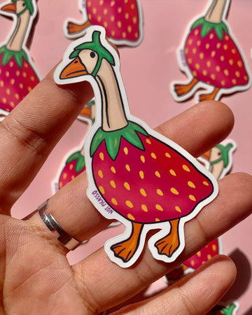model holding goose dressed as strawberry sticker