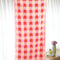 opened towel with coral, pink and white checked pattern
