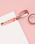 rolls of pink washi tape with cute abstract fruit stickers print on paper
