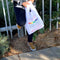 model holding embroidered rainbow thank you reusable bag