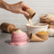 model using pink ice cream cone measuring cups