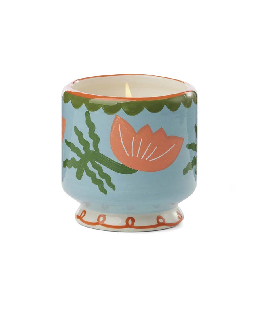 blue 8 oz candle with pink flower design