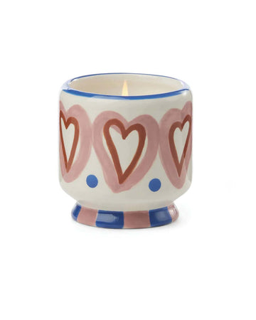 cream 8 oz candle with pink and red heart print