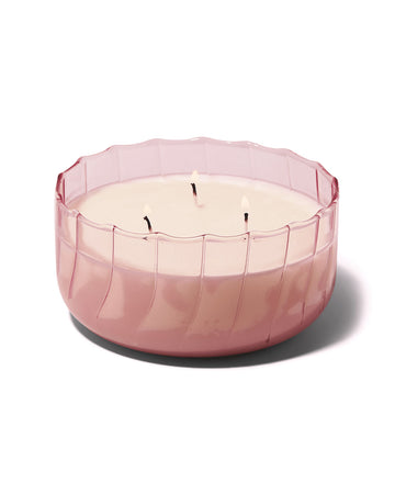 three wick candle in a pink ripple vessel