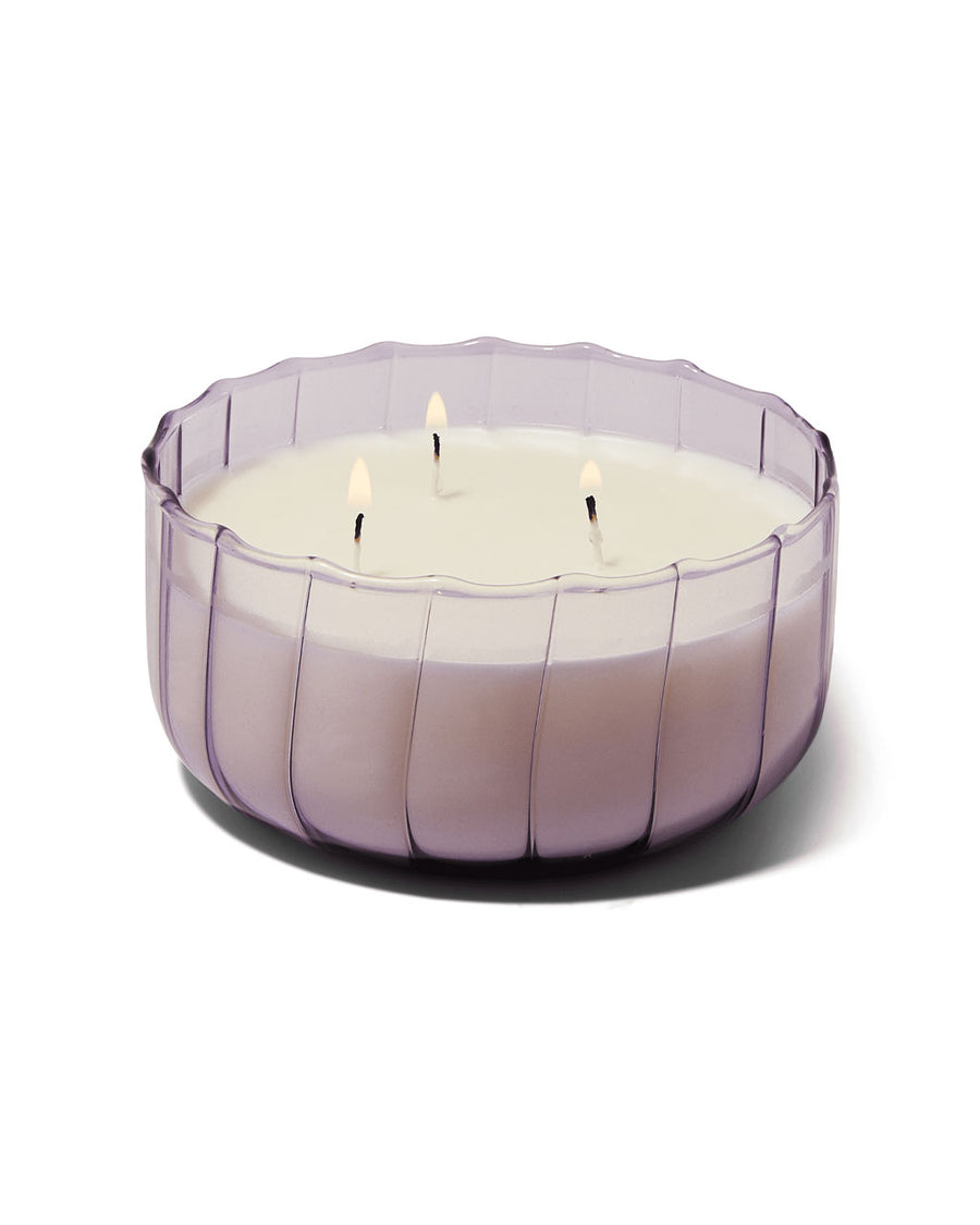 three wick candle in a lavender ripple vessel