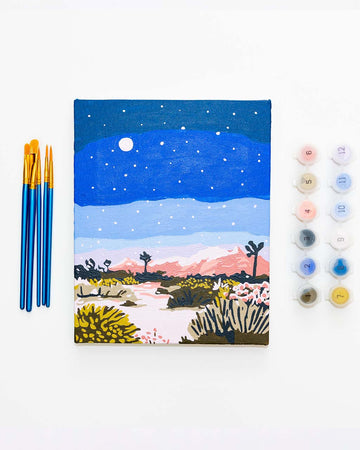painted mini paint by numbers set with nightime joshua tree scene, paint brushes and pots of paint