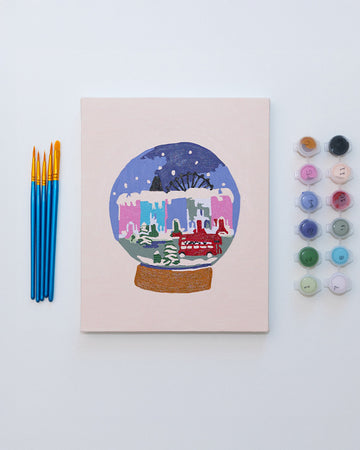 painted paint by numbers kit with snowy snowglobe scene with 5 paintbrushes and 12 pots of paint