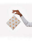model holding swedish dishcloth with abstract egg print