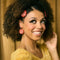 model wearing tomato slice dangle earrings and hair clips