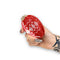 model holding red and pink ornament shaped hair claw