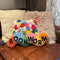 colorful worm throw pillow with 'BOOKWORM' across the front