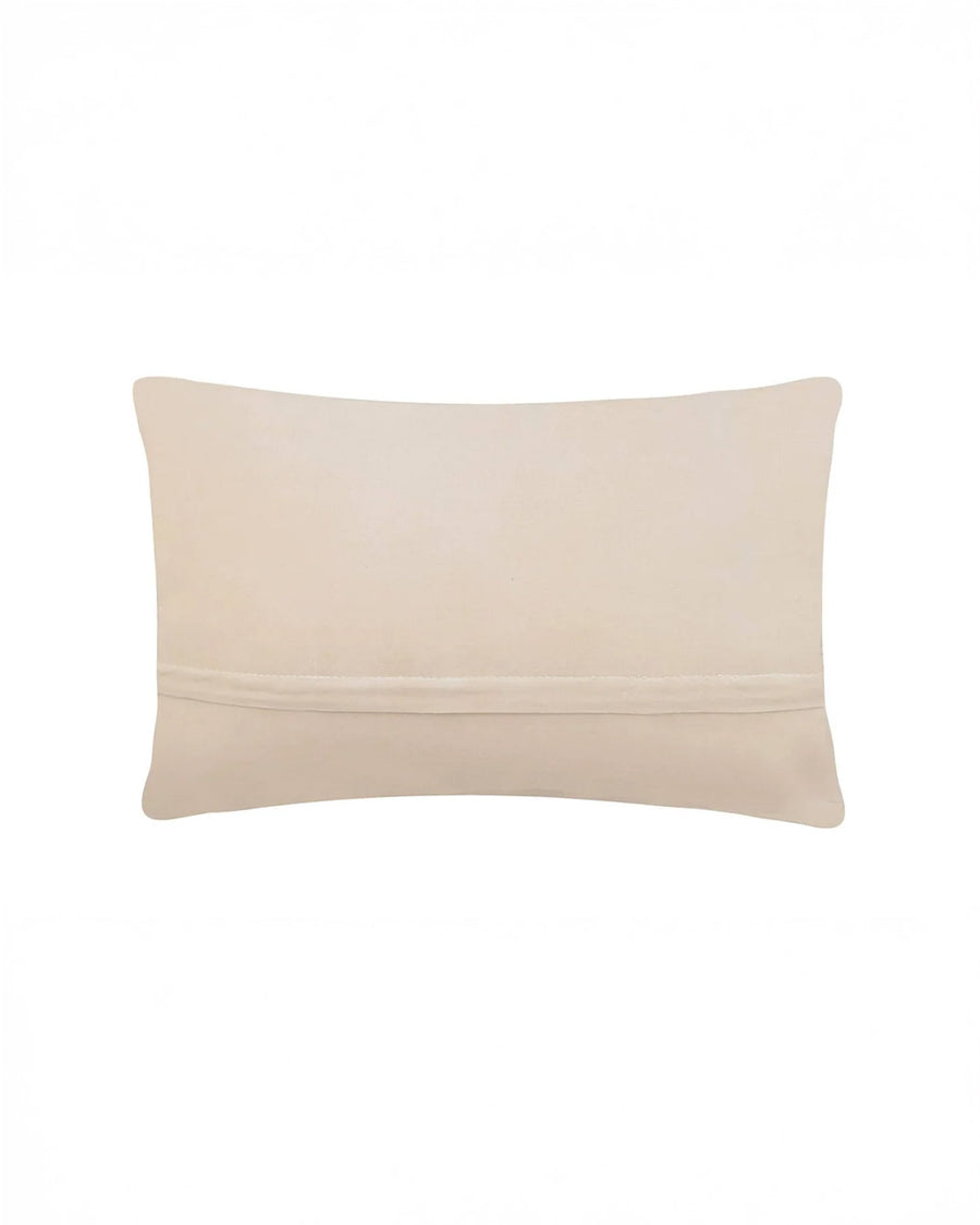 cream back of blue throw pillow with white whale print