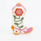 white boot shaped throw pillow with pink and yellow flower design