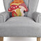 mushroom trio throw pillow with orange polka dot, red and white stripe and red and white mushrooms on chair
