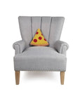 slice of pepperoni pizza hooked pillow on chair