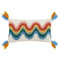 white throw pillow with wavy rainbow print and blue and yellow tassels