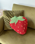 strawberry shaped throw pillow on couch