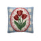 blue square throw pillow with red tulip print