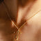 up close of model wearing gold thin bow necklace