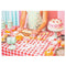 completed man in an apron baking 1000 piece puzzle