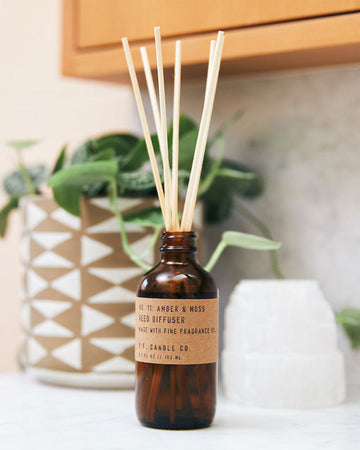 amber and moss scented 3.5 fl oz. reed diffuser
