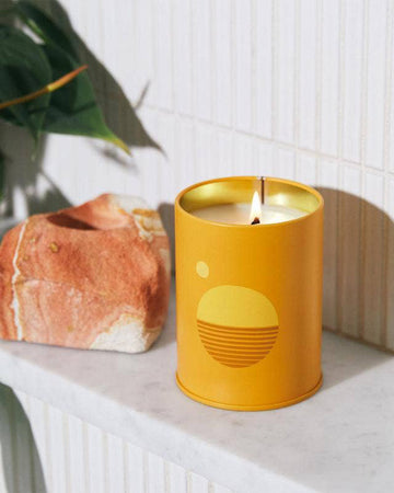lit yellow tin soy candle