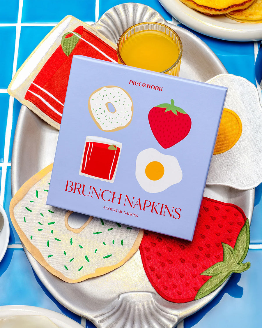packaged set of 4 brunch linen napkins: bloody mary, strawberry, egg, and bagel with cream cheese